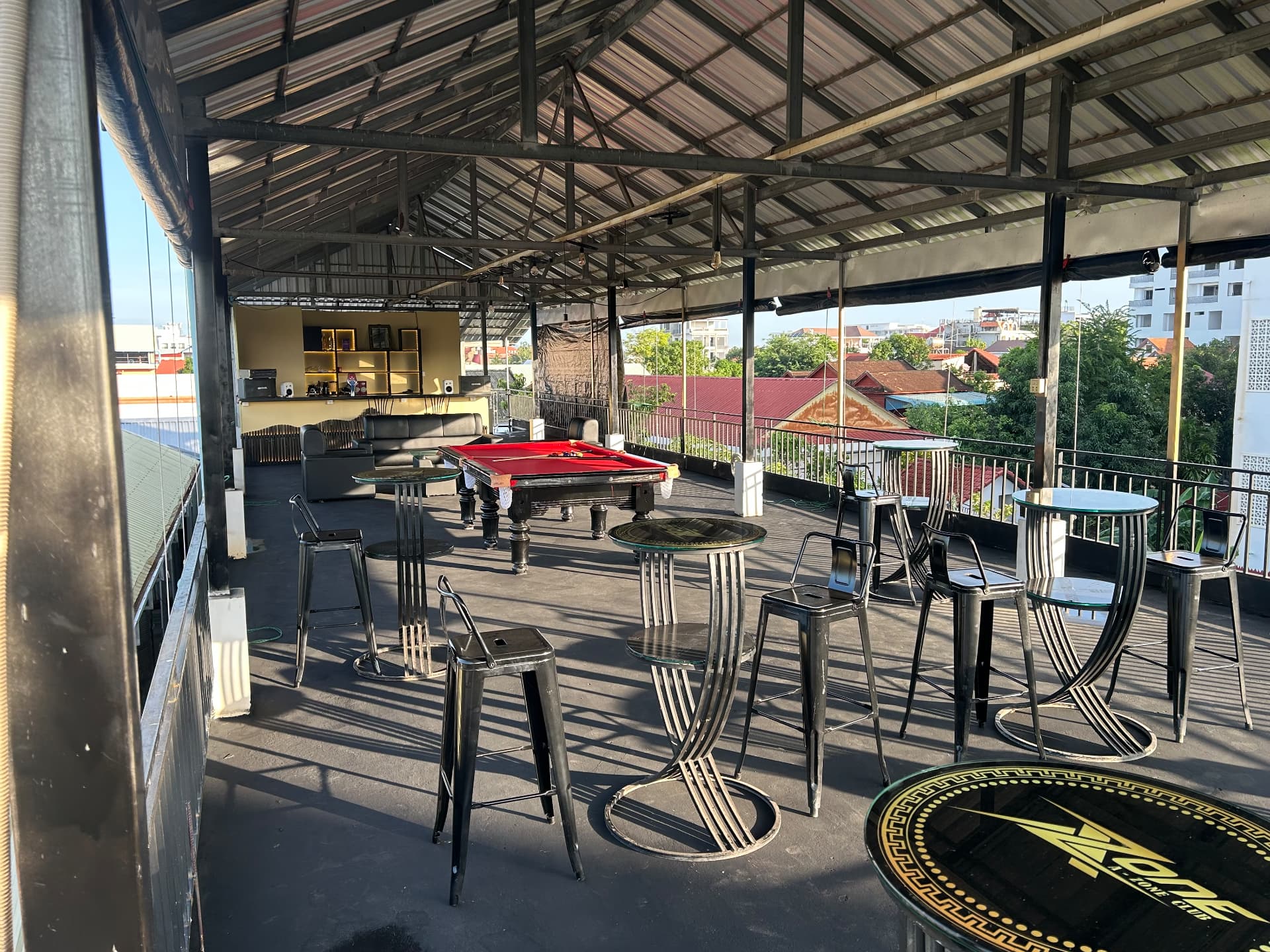 Nomadic Sky Lounge rooftop with pool table and bar seating
